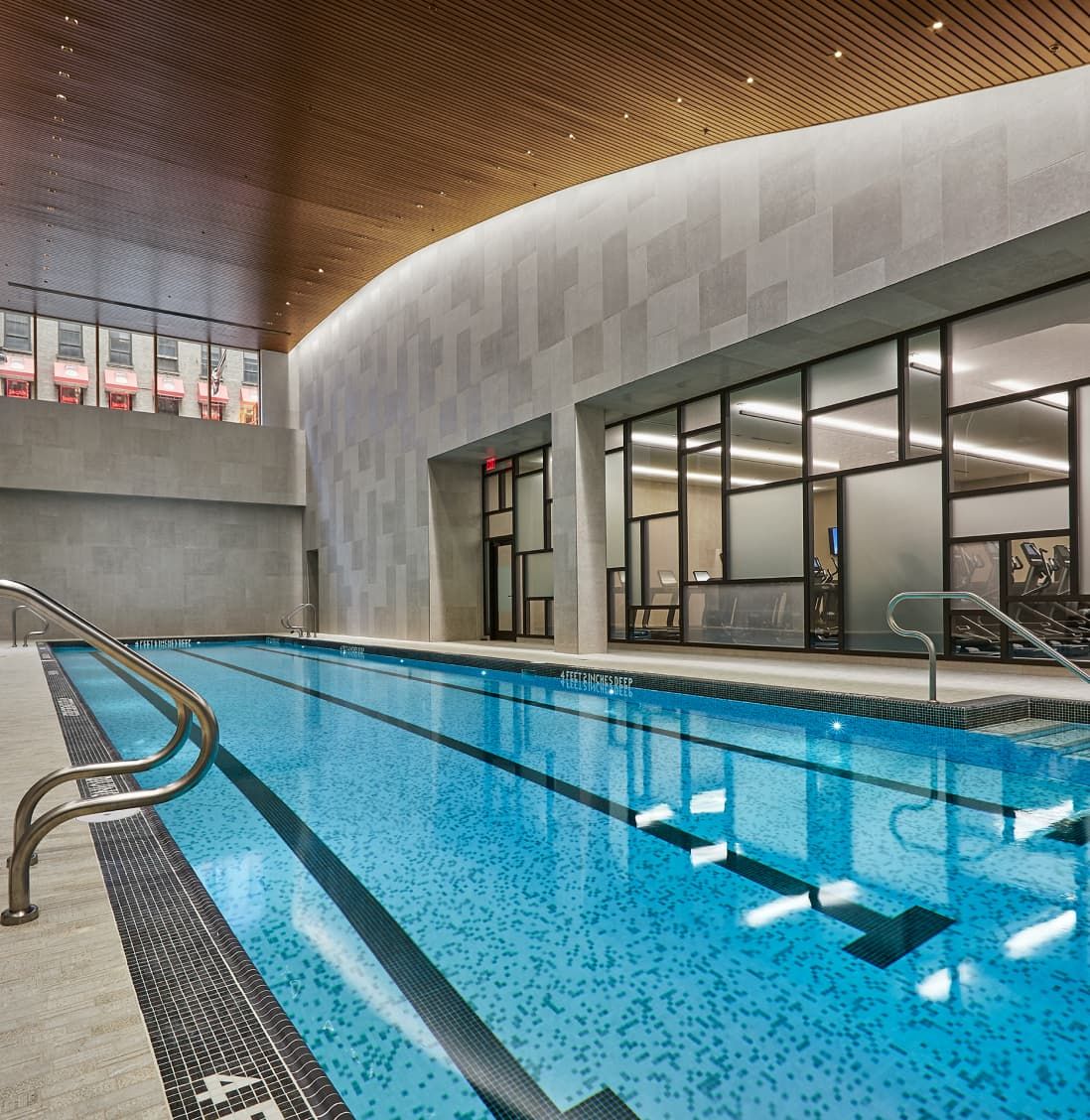 A stylish indoor swimming pool, highlighting contemporary architecture and design aesthetics from EOS.