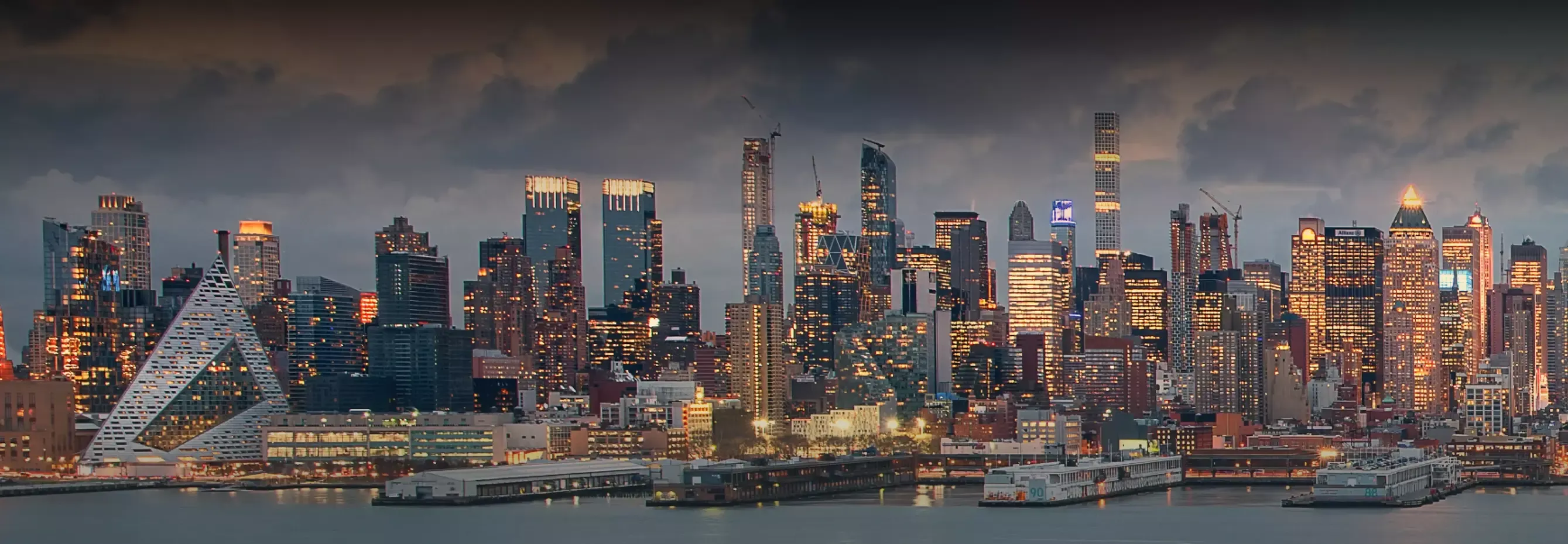 A vibrant city skyline showcasing a variety of Durst buildings reaching towards the sky in the background.