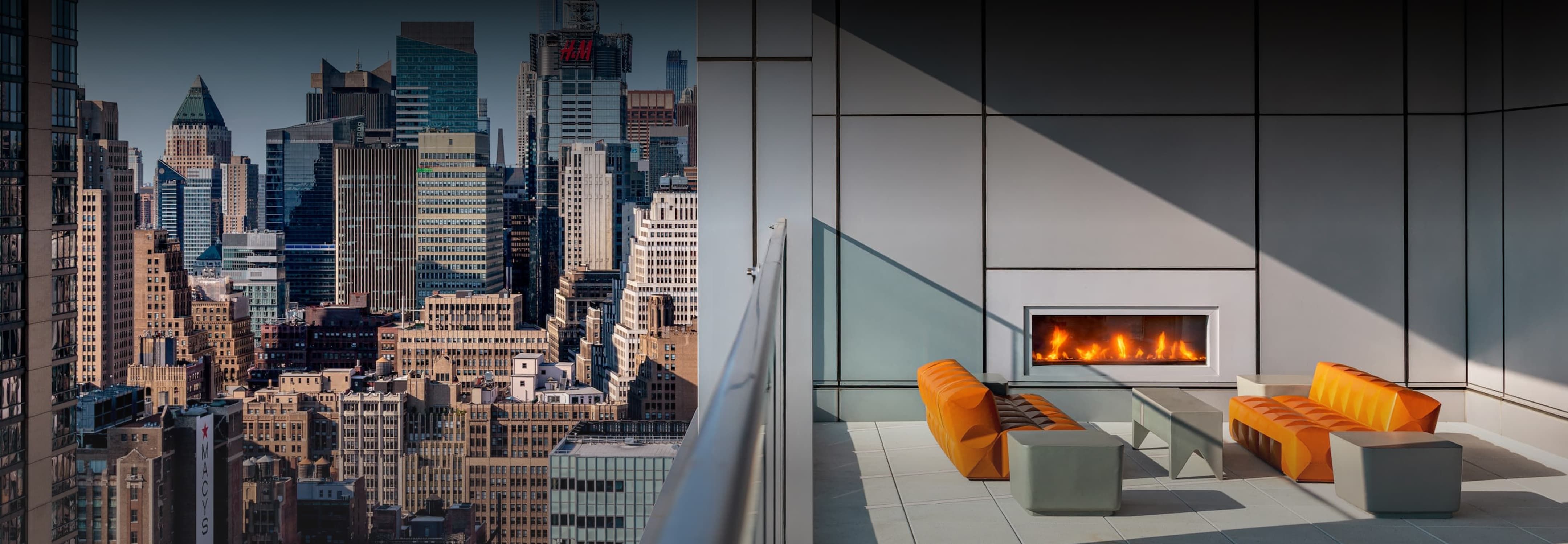 A panoramic view of the New York City skyline from EOS' comfortable rooftop patio, showcasing iconic skyscrapers against a clear blue sky.